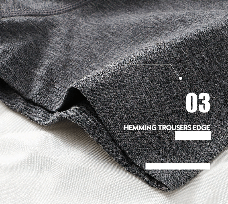 Close-up of dark gray hem on solid color cotton male boxers, showcasing quality stitching and breathable fabric design.